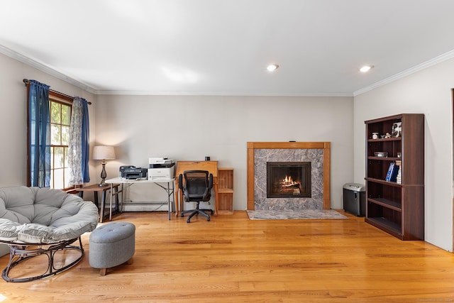 241 New London Rd, Colchester, CT 06415 - living room with light wood finished floors, crown molding, a fireplace, a desk, and recessed lighting