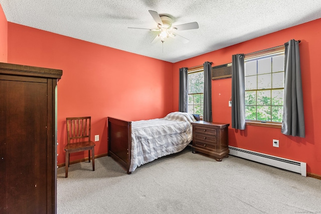 241 New London Rd, Colchester, CT 06415 - bedroom with baseboard heating, light colored carpet, a textured ceiling, ceiling fan, and baseboards