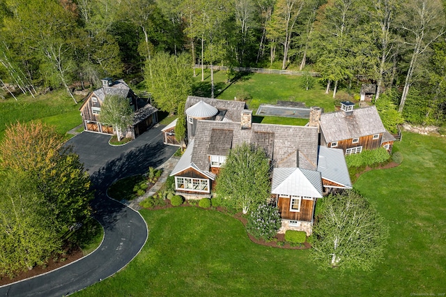 view of subject property featuring a heavily wooded area