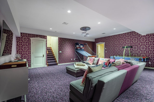 carpeted cinema with wallpapered walls and recessed lighting