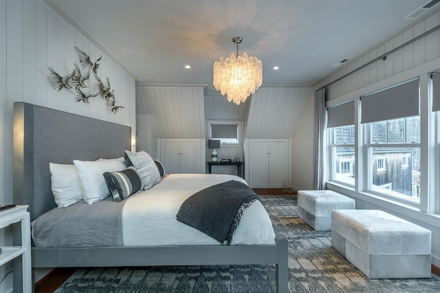 bedroom featuring ornamental molding, a chandelier, and wooden walls