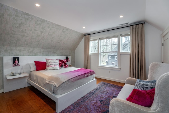 bedroom with vaulted ceiling, wood finished floors, baseboards, and recessed lighting
