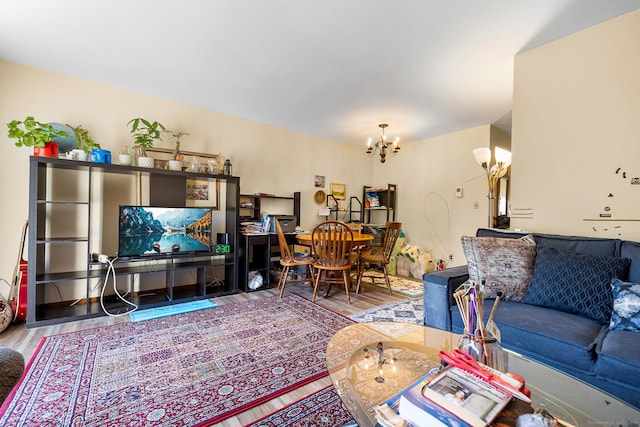living room featuring a chandelier and wood finished floors