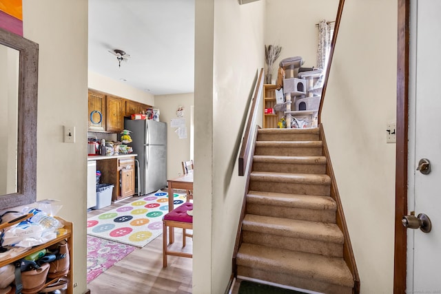 stairs with wood finished floors