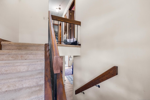 stairs with wood finished floors