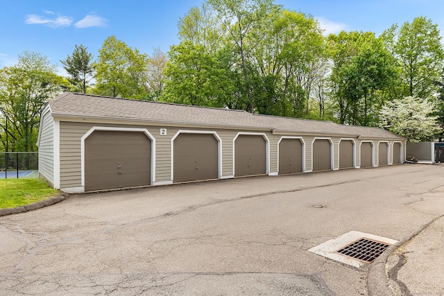 garage featuring fence