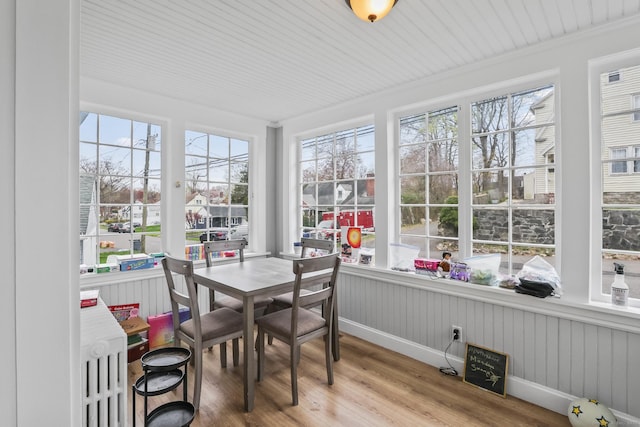 sunroom / solarium featuring wood finished floors