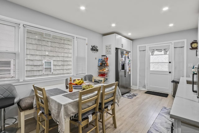 dining area featuring recessed lighting, light wood-style flooring, and baseboards