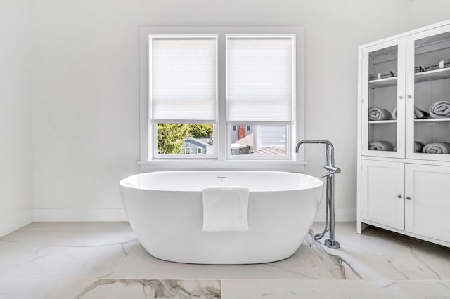 706 Judd St, Fairfield, CT 06825 - full bath with marble look tiles and a soaking tub
