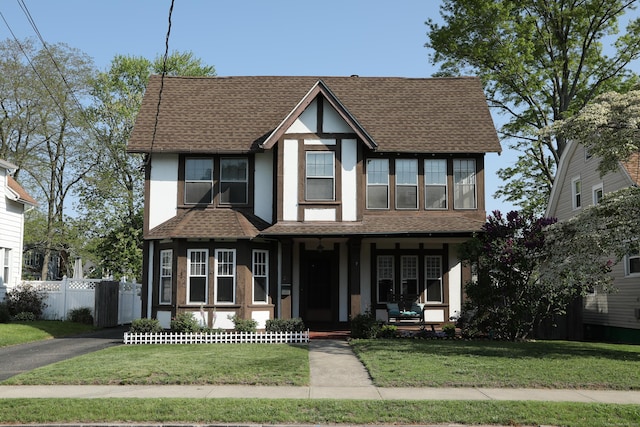 21 E Brown St, West Haven, CT 06516 - view of front of house featuring stucco siding, covered porch, and roof with shingles