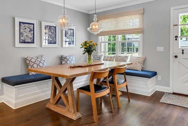 dining room with breakfast area, ornamental molding, wood finished floors, plenty of natural light, and baseboards