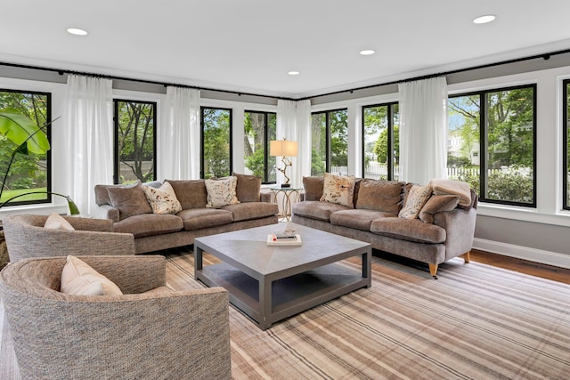 living area featuring recessed lighting, light wood-style floors, and baseboards