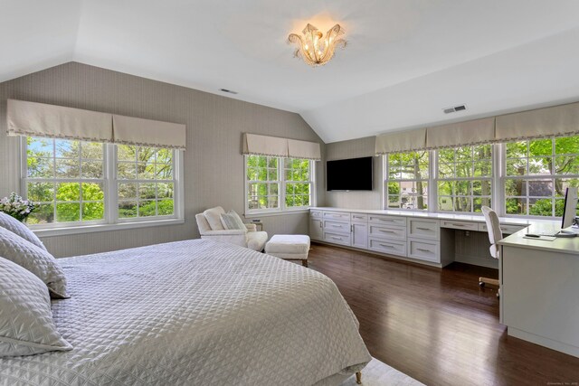 bedroom featuring vaulted ceiling, dark wood-style flooring, and a chandelier