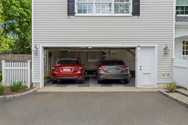 garage featuring fence
