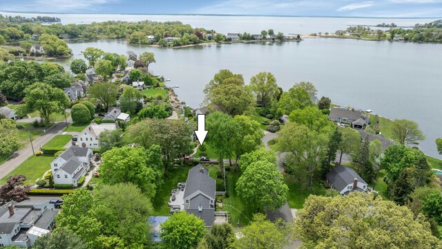 aerial view of property's location featuring nearby suburban area and a nearby body of water