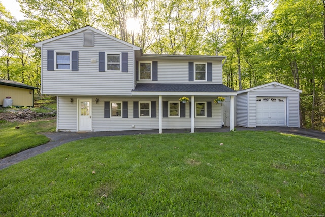129 Midwood Ave, Wolcott, CT 06716 - view of front of house featuring driveway, a front yard, roof with shingles, and a garage