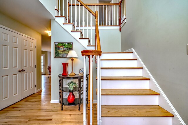 539 Plains Rd, Milford, CT 06461 - stairway with wood finished floors and baseboards