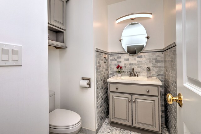 539 Plains Rd, Milford, CT 06461 - bathroom featuring tile walls, toilet, and vanity