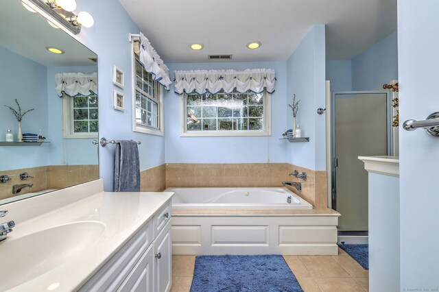 539 Plains Rd, Milford, CT 06461 - full bathroom featuring a shower stall, a bath, tile patterned flooring, a baseboard heating unit, and vanity