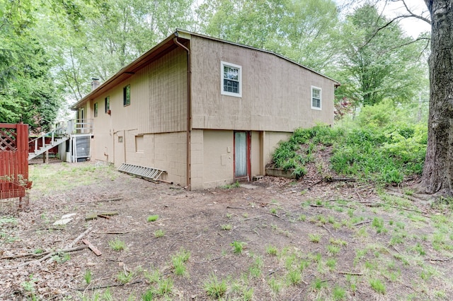 view of property exterior featuring stairway