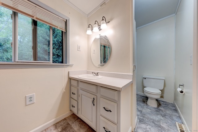bathroom with crown molding, baseboards, toilet, and vanity