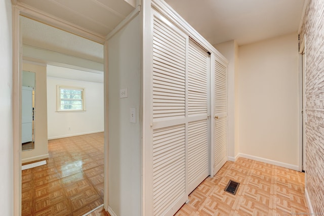 hall featuring baseboards