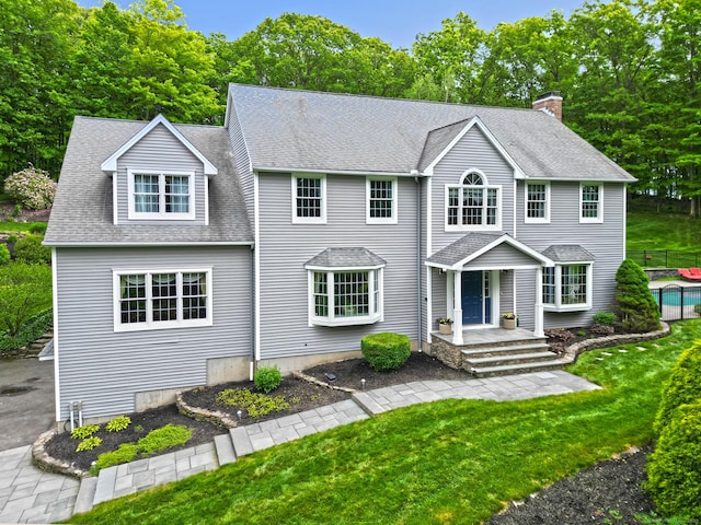 250 Wooding Hill Rd, Bethany, CT 06524 - view of front of house with a chimney, a porch, and a shingled roof
