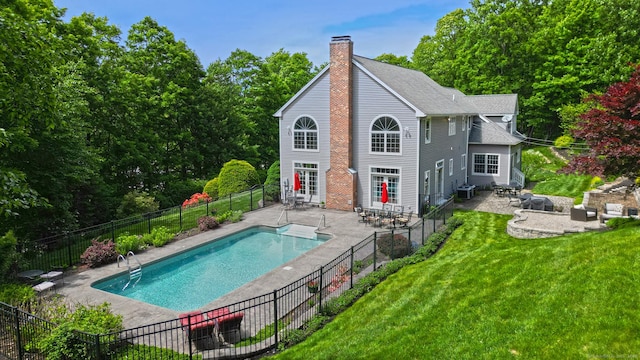 250 Wooding Hill Rd, Bethany, CT 06524 - rear view of house featuring a patio, a chimney, central AC unit, and a shingled roof