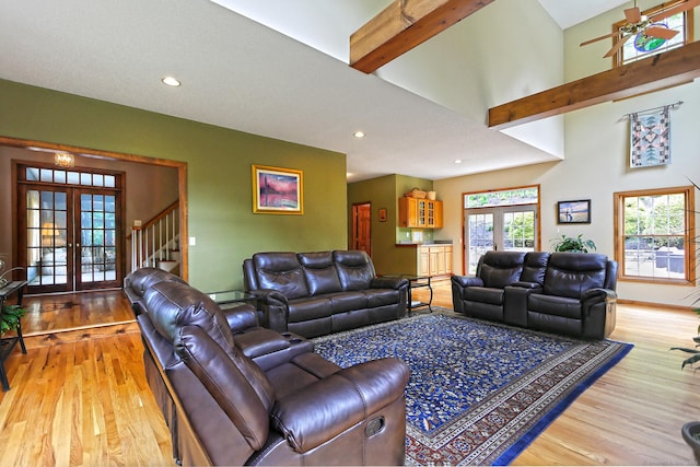 250 Wooding Hill Rd, Bethany, CT 06524 - living area with french doors, wood finished floors, recessed lighting, beam ceiling, and stairs