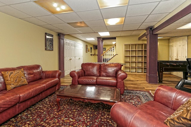 250 Wooding Hill Rd, Bethany, CT 06524 - living room featuring wood finished floors, stairway, and a paneled ceiling