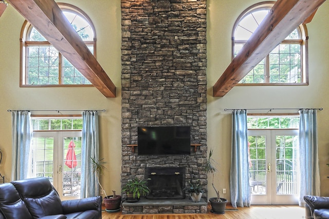 250 Wooding Hill Rd, Bethany, CT 06524 - living room featuring french doors, wood finished floors, a towering ceiling, and a fireplace