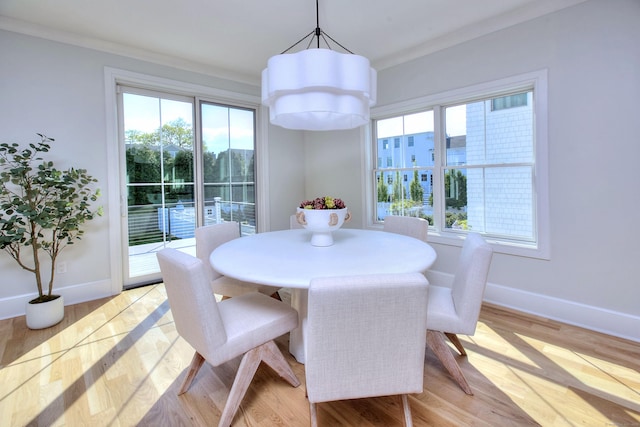 450 Penfield Rd, Fairfield, CT 06824 - dining room with plenty of natural light, baseboards, light wood-style flooring, and crown molding