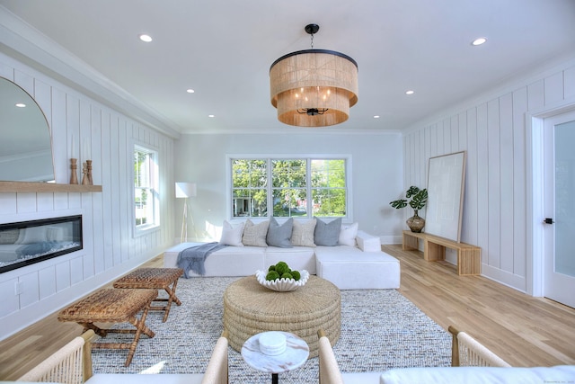 450 Penfield Rd, Fairfield, CT 06824 - living room featuring crown molding, plenty of natural light, light wood finished floors, a fireplace, and recessed lighting