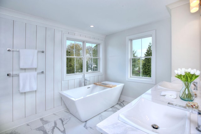 450 Penfield Rd, Fairfield, CT 06824 - full bath with plenty of natural light, a sink, marble finish flooring, a freestanding tub, and recessed lighting