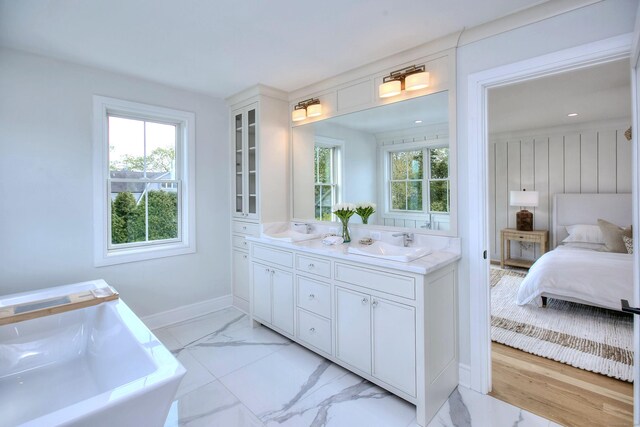 450 Penfield Rd, Fairfield, CT 06824 - full bathroom featuring healthy amount of natural light, marble look tiles, and double vanity