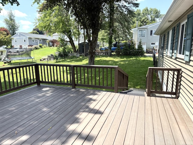 15-17 Beckerle St, Danbury, CT 06811 - wooden terrace featuring a trampoline, a residential view, and a fenced backyard