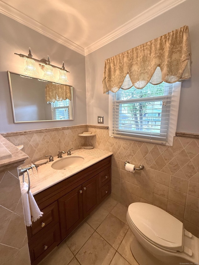 15-17 Beckerle St, Danbury, CT 06811 - half bath with tile walls, tile patterned floors, vanity, crown molding, and wainscoting
