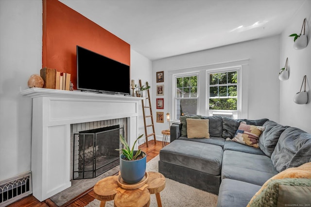 19 Orpington St, Hamden, CT 06517 - living room featuring a fireplace, wood finished floors, and baseboards