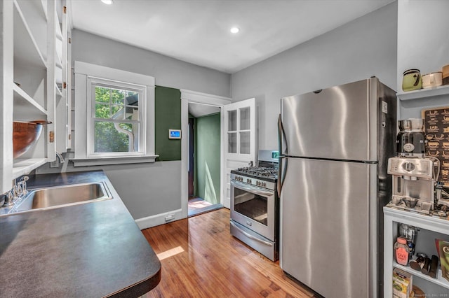 19 Orpington St, Hamden, CT 06517 - kitchen featuring appliances with stainless steel finishes, a sink, wood finished floors, baseboards, and recessed lighting