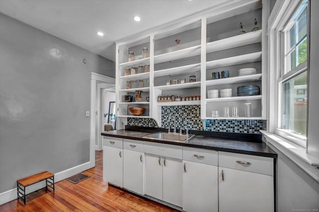 19 Orpington St, Hamden, CT 06517 - kitchen featuring open shelves, a sink, dark countertops, tasteful backsplash, and recessed lighting