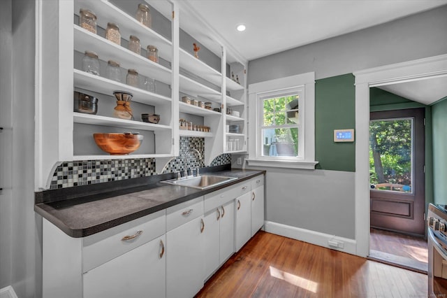 19 Orpington St, Hamden, CT 06517 - kitchen featuring a sink, open shelves, dark countertops, and healthy amount of natural light