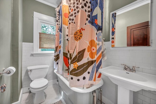 19 Orpington St, Hamden, CT 06517 - bathroom with tile walls, tile patterned floors, toilet, wainscoting, and shower / tub combo with curtain