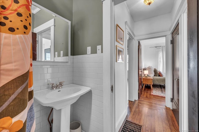 19 Orpington St, Hamden, CT 06517 - bathroom featuring healthy amount of natural light, wood finished floors, and tile walls