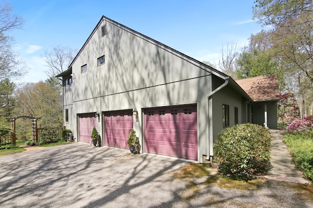 view of side of property with driveway