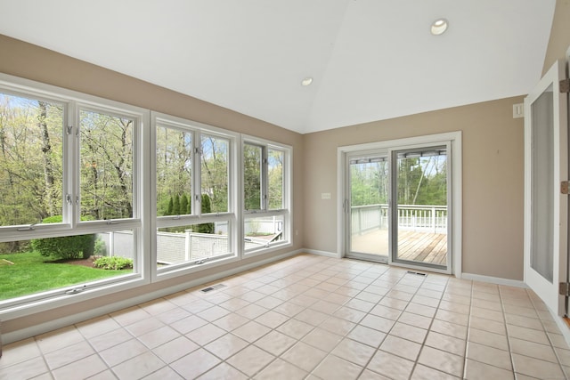 unfurnished sunroom featuring french doors, lofted ceiling, tile patterned flooring, baseboards, and recessed lighting