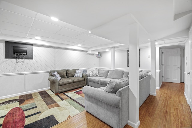 living area featuring wood finished floors, recessed lighting, and baseboards