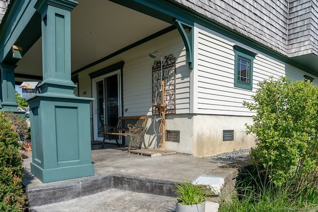 49 Bayberry Ln, Groton, CT 06340 - property entrance with a porch
