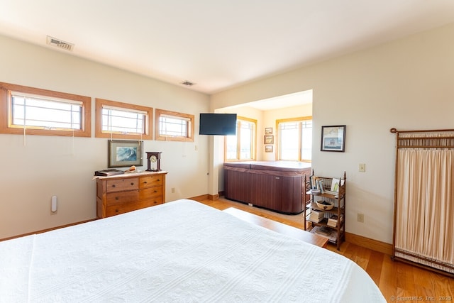 49 Bayberry Ln, Groton, CT 06340 - bedroom featuring multiple windows and wood finished floors