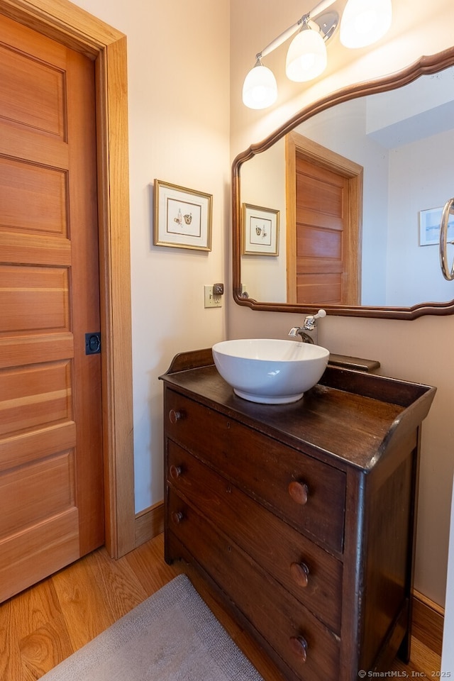 49 Bayberry Ln, Groton, CT 06340 - bathroom with vanity and wood finished floors
