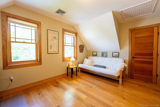49 Bayberry Ln, Groton, CT 06340 - living area with healthy amount of natural light, lofted ceiling, and light wood-style floors
